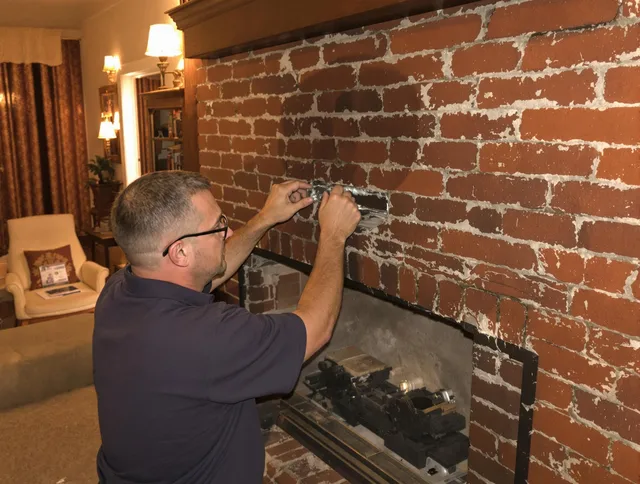 Pompano Beach Chimney Sweep expert fixing a fireplace in Pompano Beach, FL